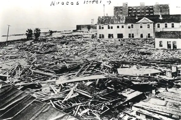 The Nueces Hotel, labeled in the background, was a refuge for Corpus Christi during the 1919 hurricane as the streets filled with storm surge and debris.