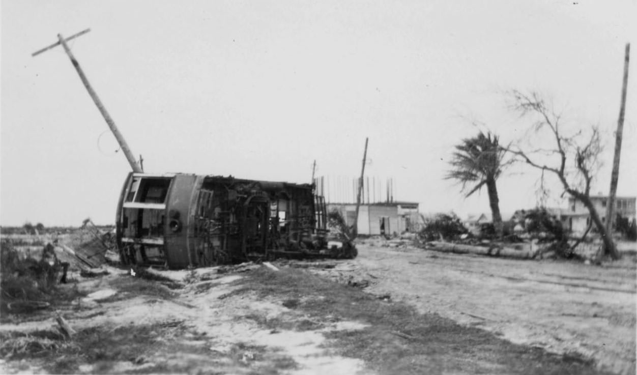 An overturned streetcar in the middle of the road in Corpus Christi, Texas around the time of a hurricane in 1919.
