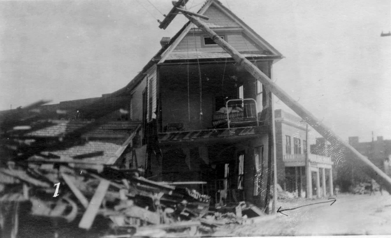 The Winona Hotel with a pole leaning in the foreground. This was taken after the hurricane that hit Corpus Christi in 1919.