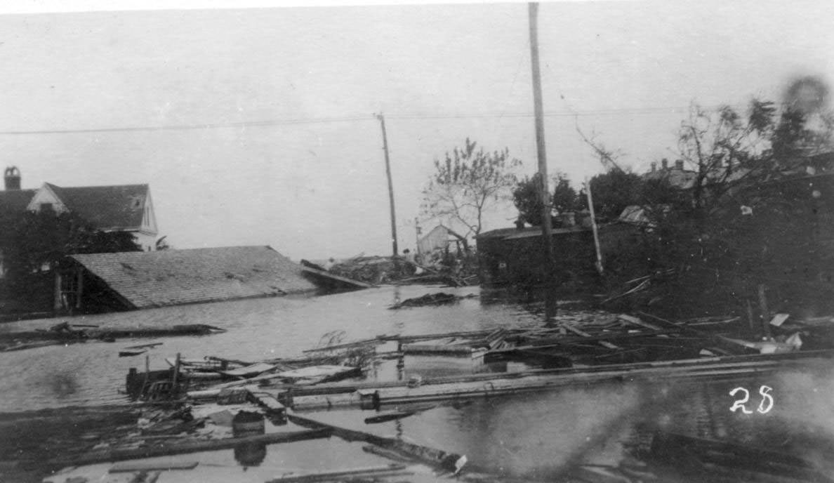 Flooded intersection of Chaparral and Taylor Streets after the hurricane of 1919 in Corpus Christi.