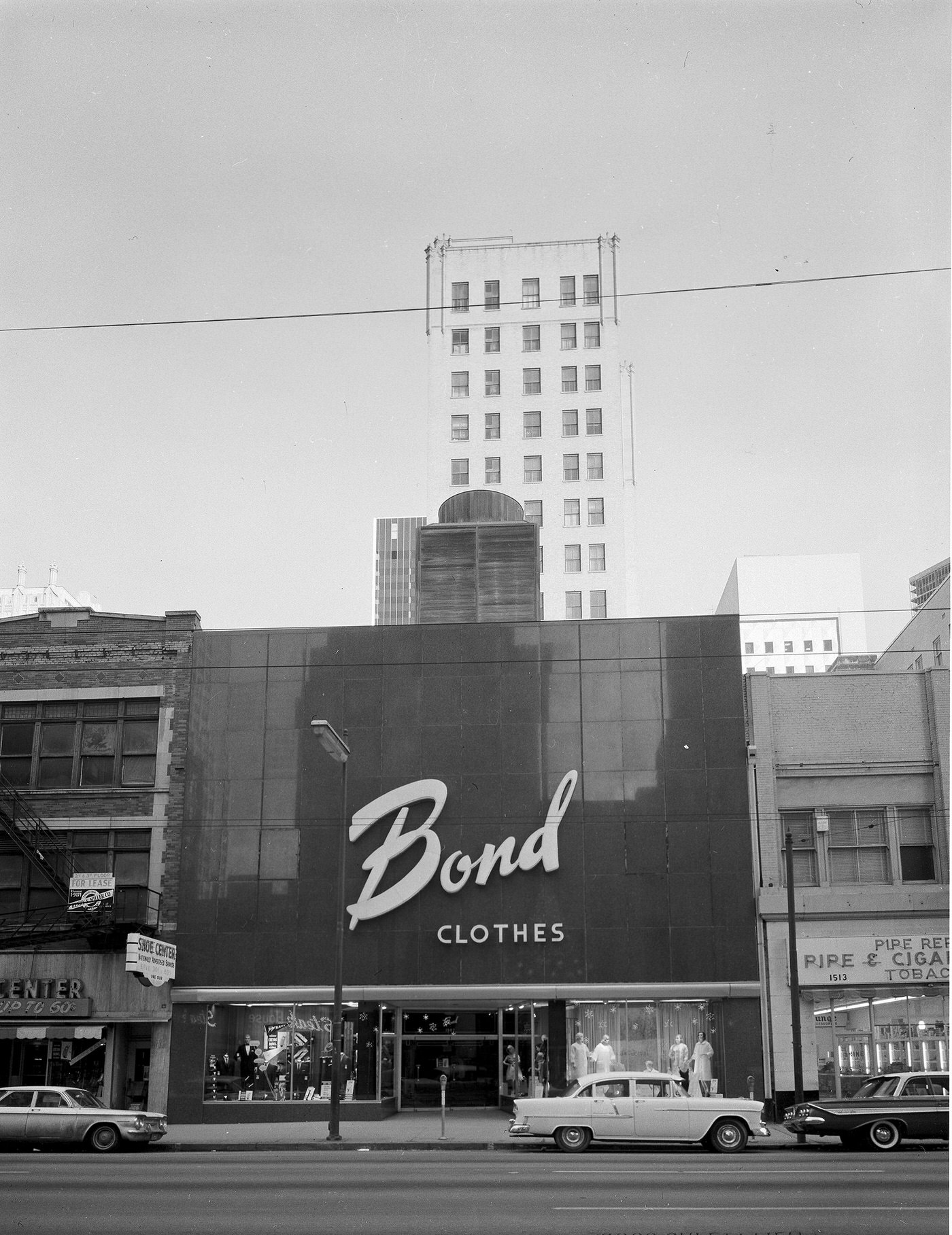 A street view of Bond Clothes store, Dallas, Texas, 1963