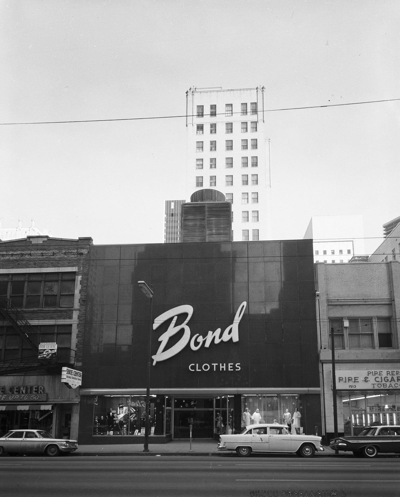 A street view of Bond Clothes store, Dallas, Texas, 1963