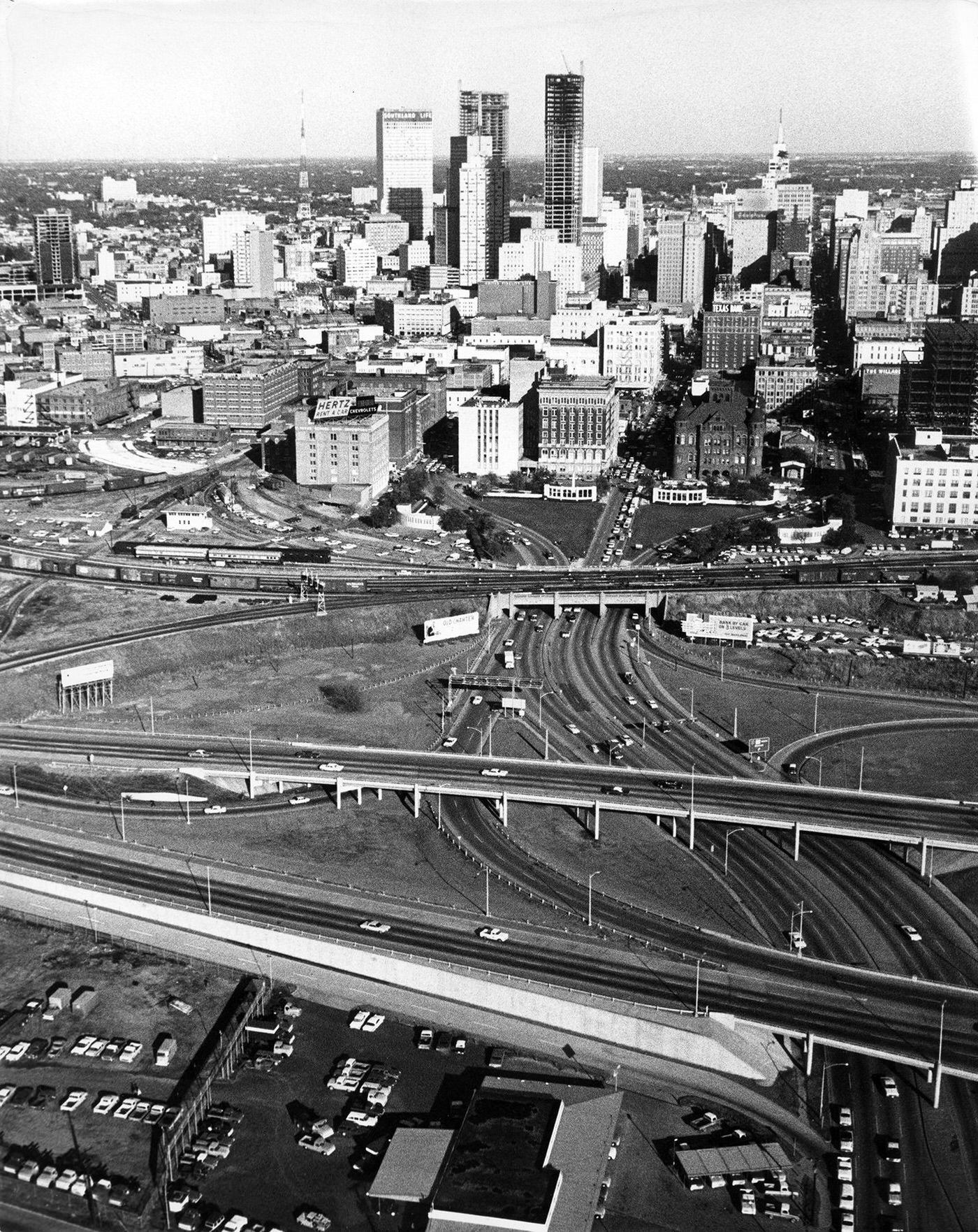 A skyline view of Dallas showing Dealey Plaza, triple underpass, Texas School Book Depository building after assassination of President John F. Kennedy, 1963