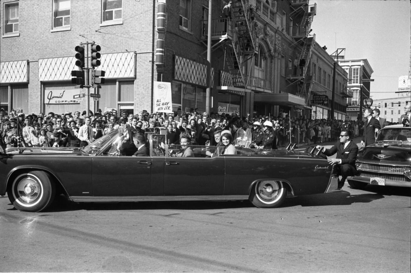 The presidential limousine turning onto main street in downtown Dallas, 1963