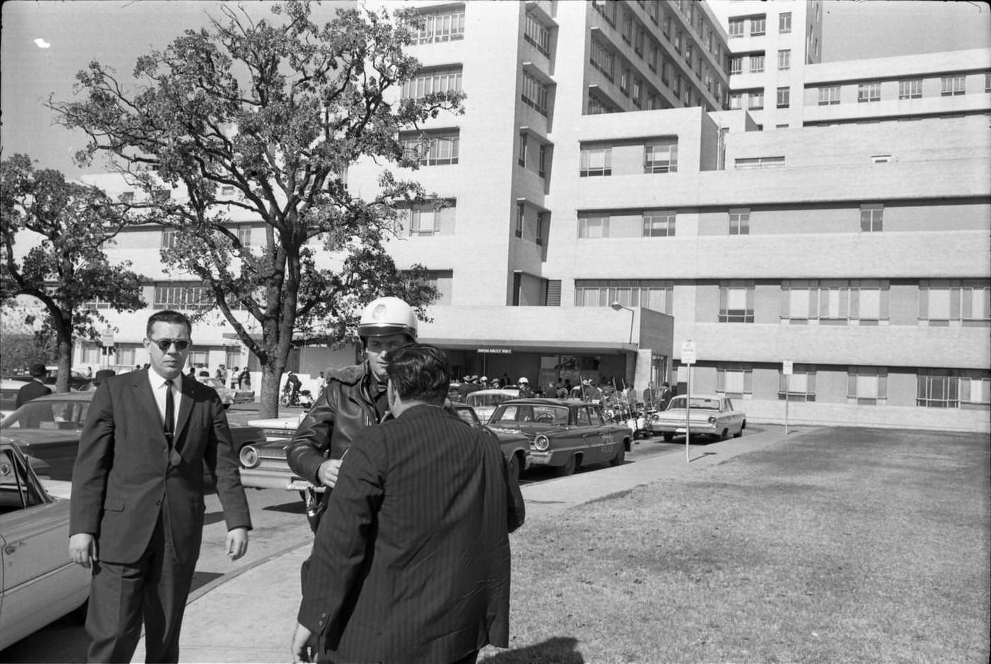 Dallas Police Officer H.B. McLain outside of Parkland Hospital, 1963