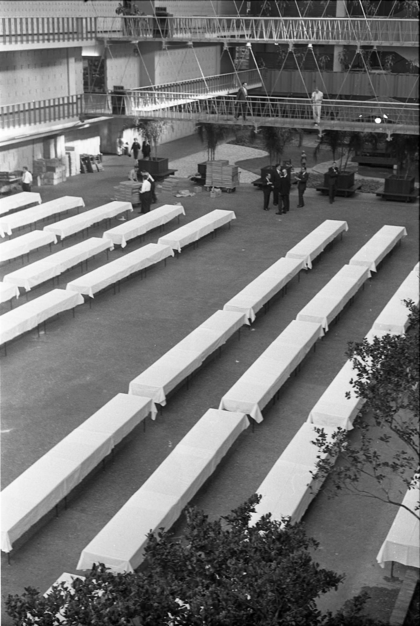 Banquet tables being set up at the Dallas Trade Mart, 1963