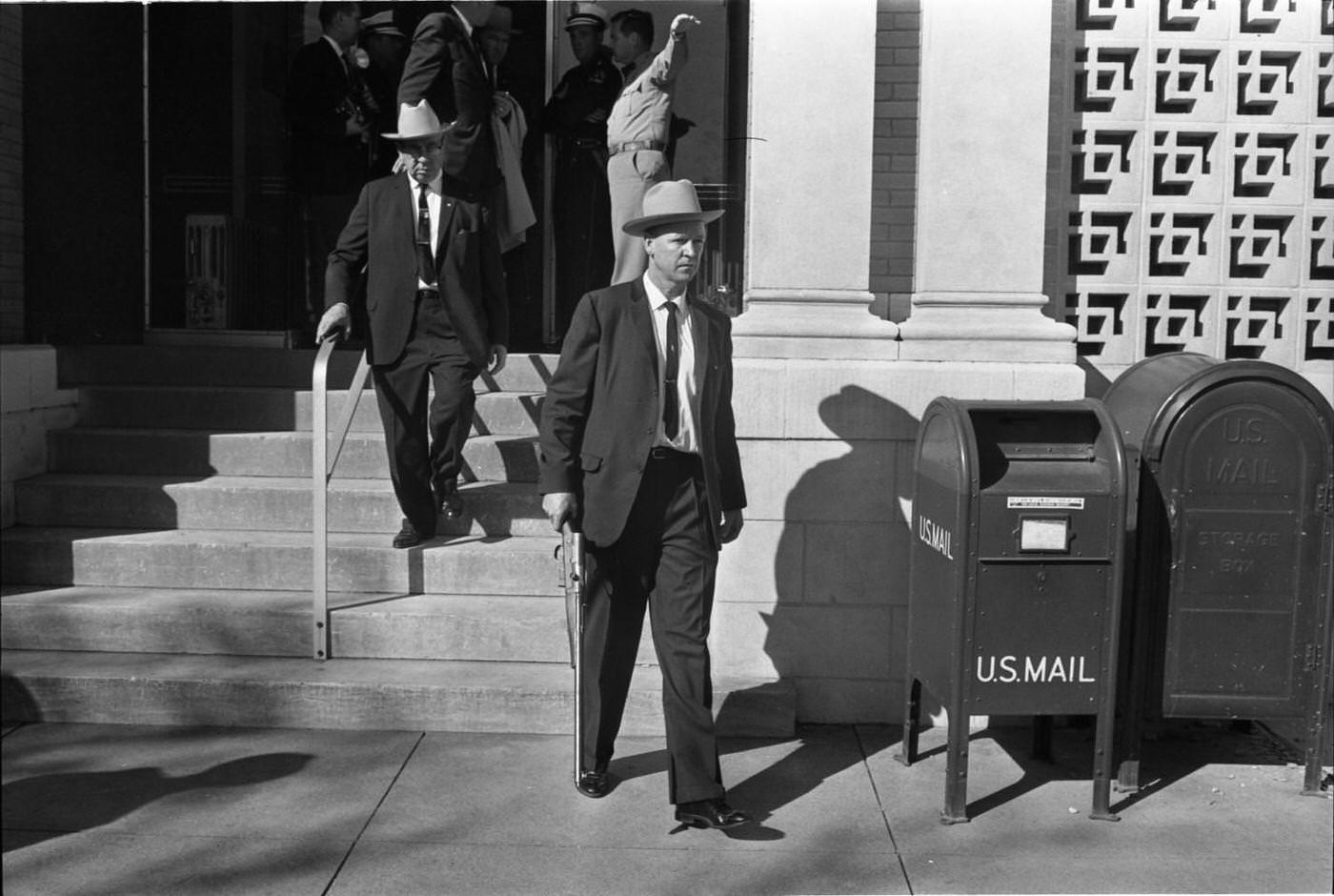 Dallas Police officers exiting the Texas School Book Depository, 1963