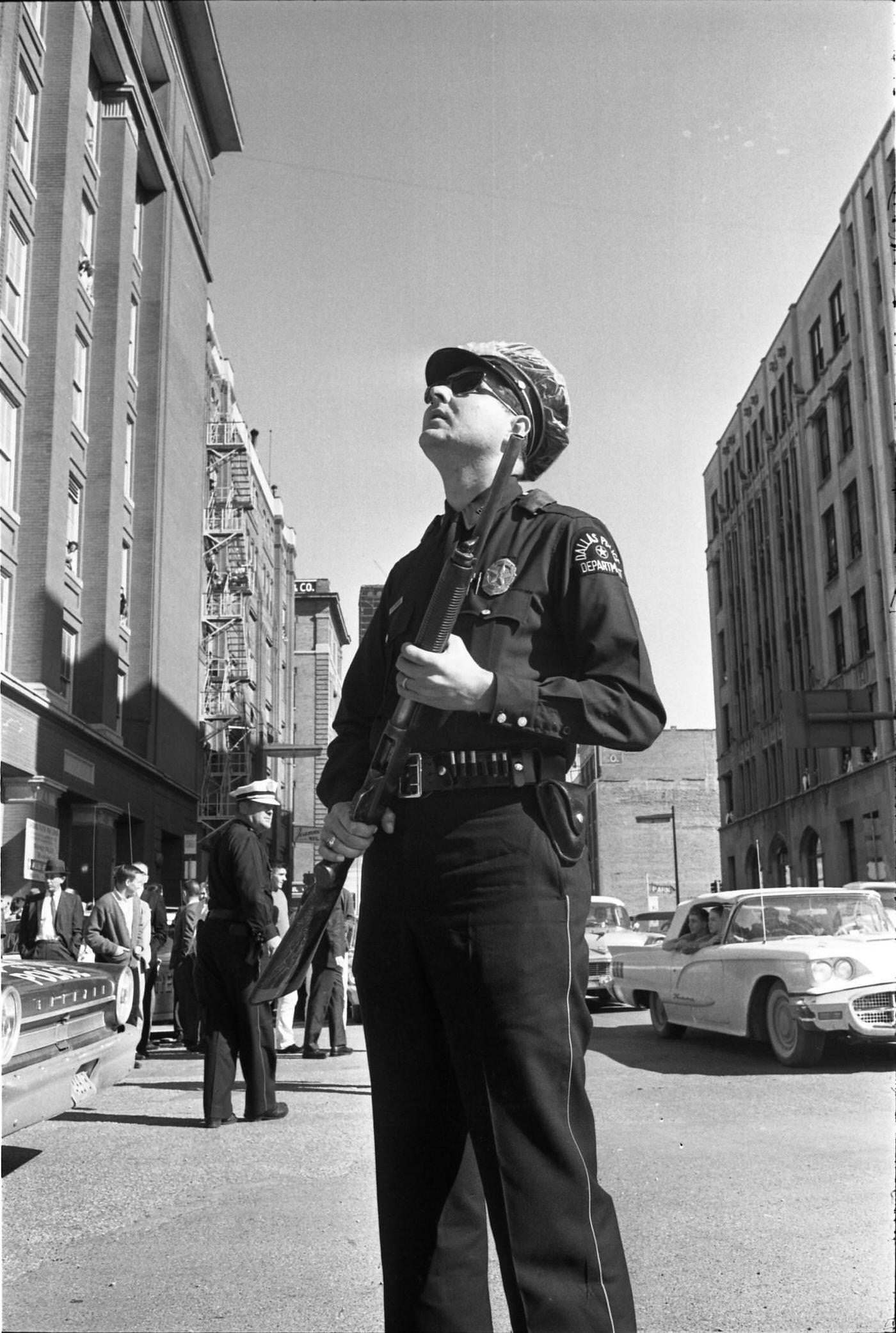A Dallas Police officer outside the Texas School Book Depository, 1963