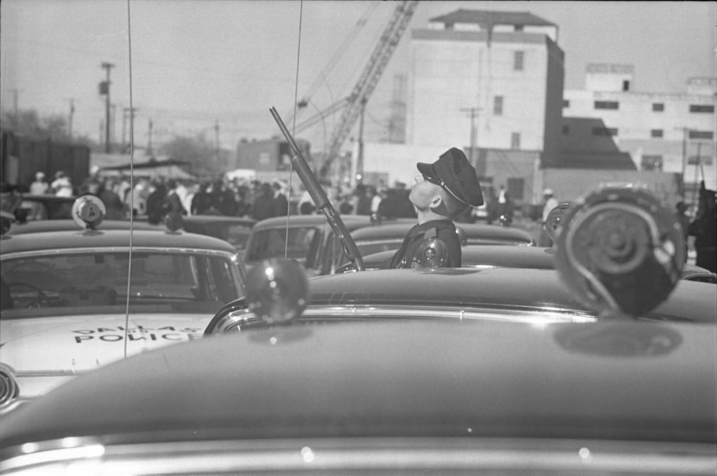 Dallas Police officer outside the Texas School Book Depository, 1963