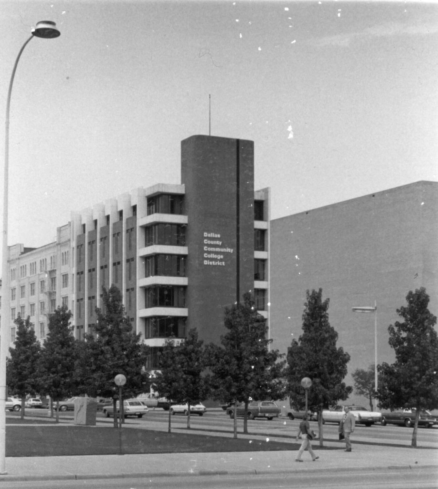 Office building at 701 Elm Street in Dallas, Texas taken from street, 1960s. The building is marked Dallas County Community College District. This building was also known as the R.L. Thornton building.