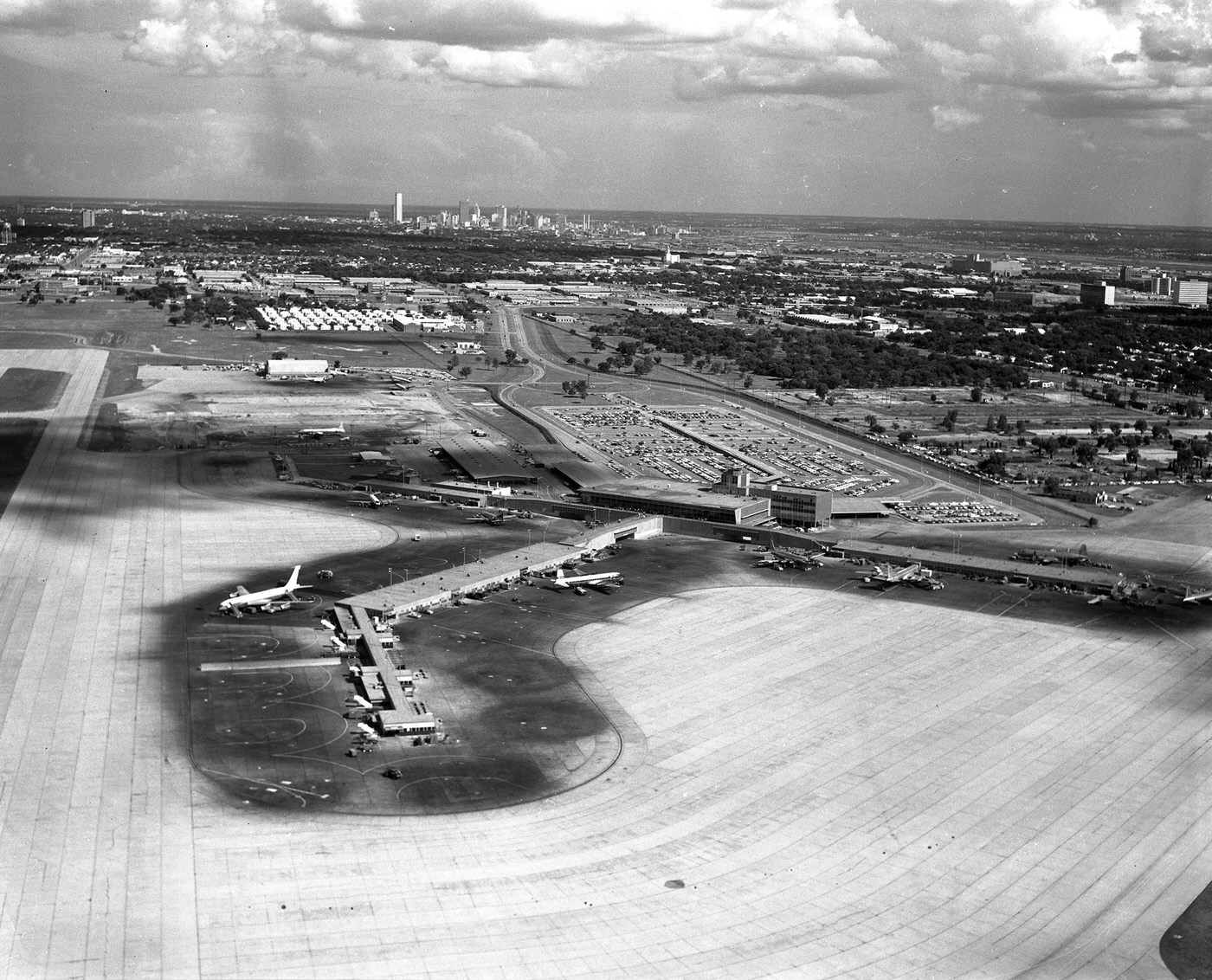 Aerial of Love Field, its terminal and runway, looking south toward downtown Dallas, Texas, 1962
