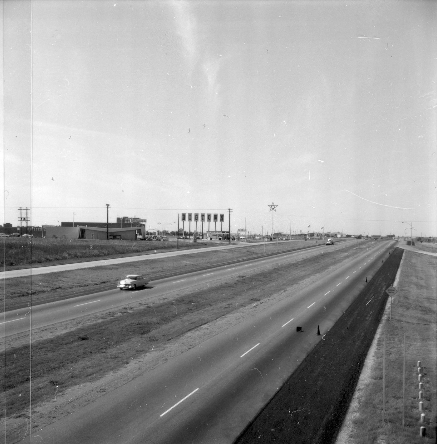 The Dallas area highway with Bigtown sign on left, 1960