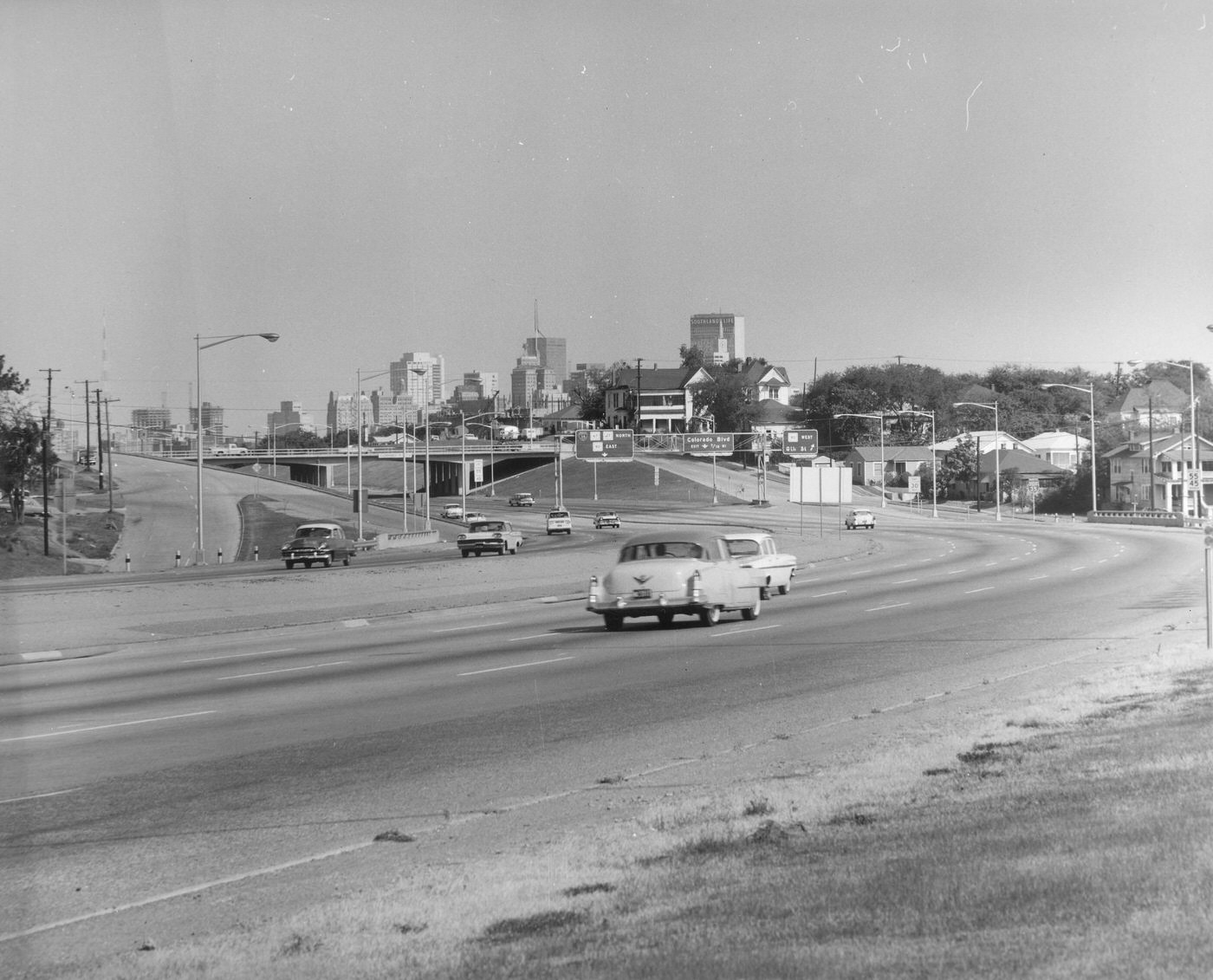 Highway with exit signs "Colorado Blvd" and connections to I-35, Highway. 67 and 77 North and 80 East, and 80 West, Dallas, 1960s