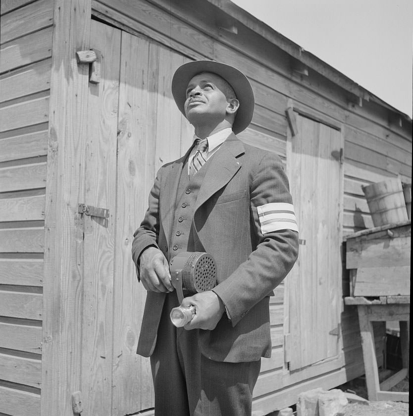Shipyard worker does volunteer duty as an air raid warden, Newport News, 1932
