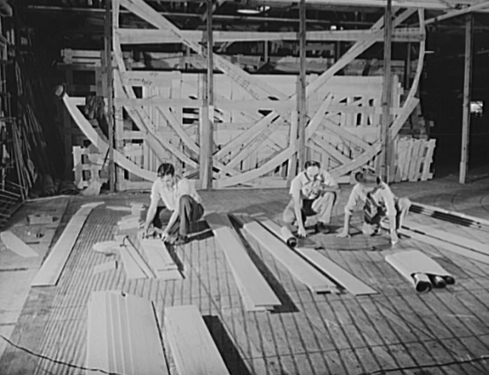 These are mold loft workers laying out patterns for various parts of naval vessels under construction, 1941