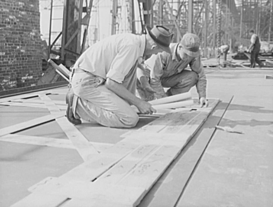 These workers are marking off the design for a ship's plate, using a template as a guide, 1941