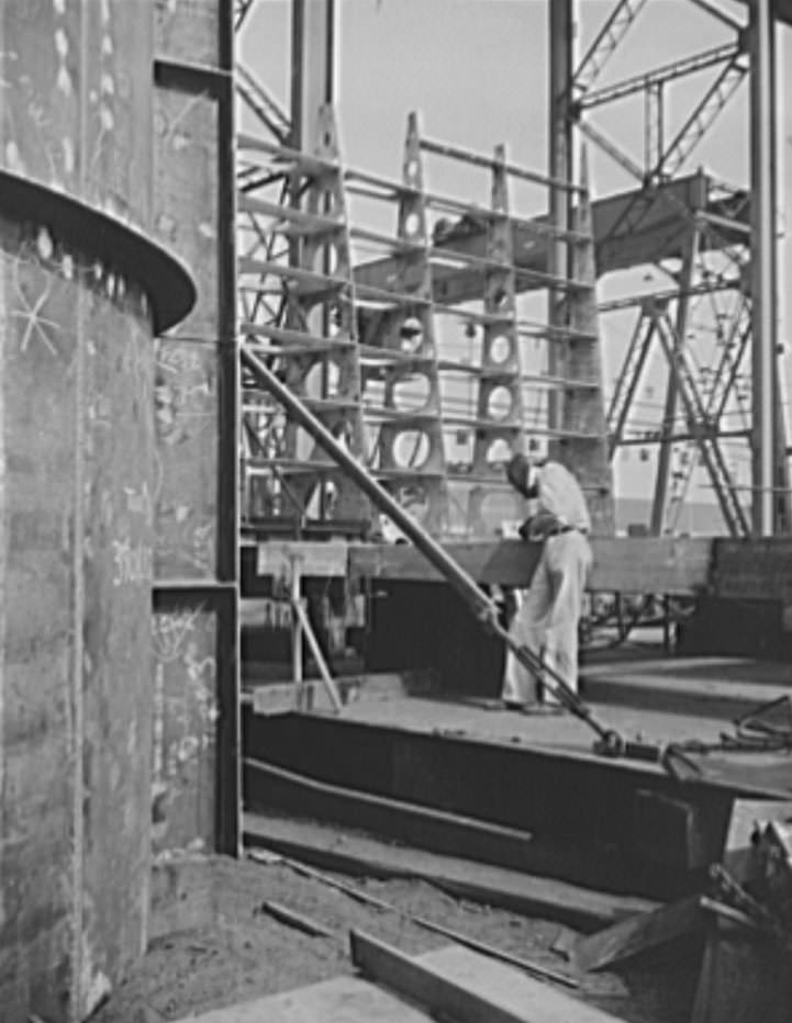 This is a structural section, where preliminary work is done before the sections for new naval vessels are brought by overhead carriers to the ways, where they will become a part of the assembled ship, 1941