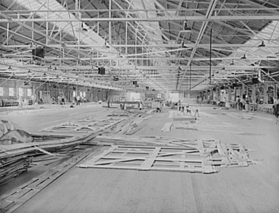 These are mold loft workers laying out patterns for various parts of naval vessels under constructions. These patterns are subsequently transferred to steel, 1941