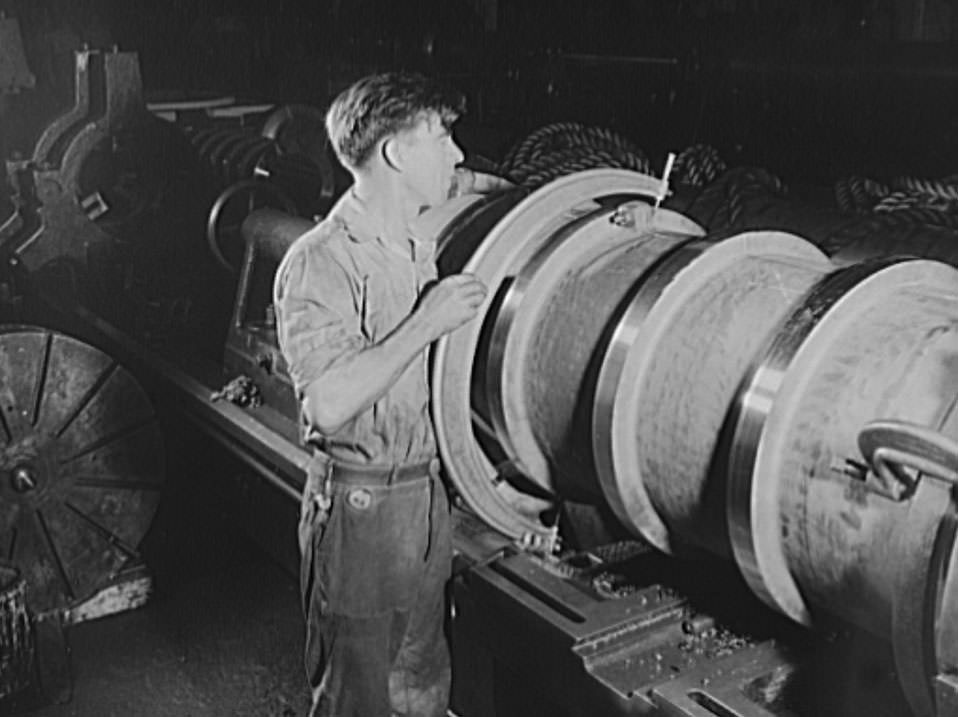 It's got to measure up, or else. This skilled worker is checking the dimensions of a tail shaft bearing for a navy vessels under construction, 1941