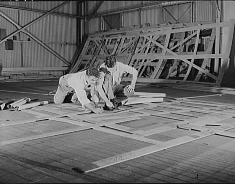 These are mold loft workers laying out patterns for various parts of naval vessels under construction, 1941