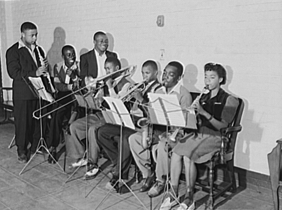 Shipyard worker (second from right) participates in a musical organization, 1940 May.