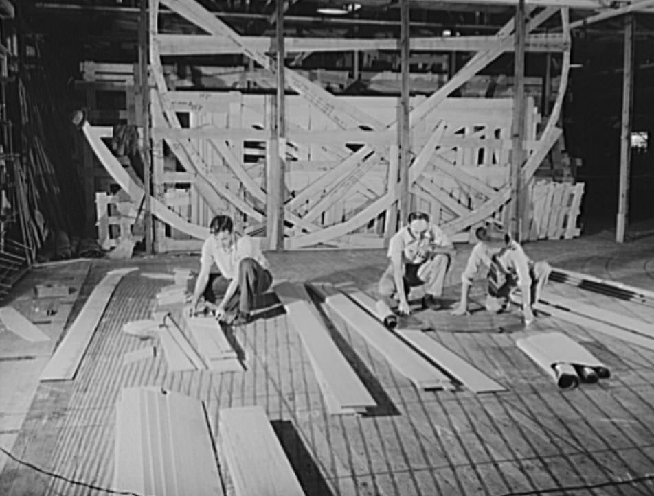 These are mold loft workers laying out patterns for various parts of naval vessels under construction, 1941