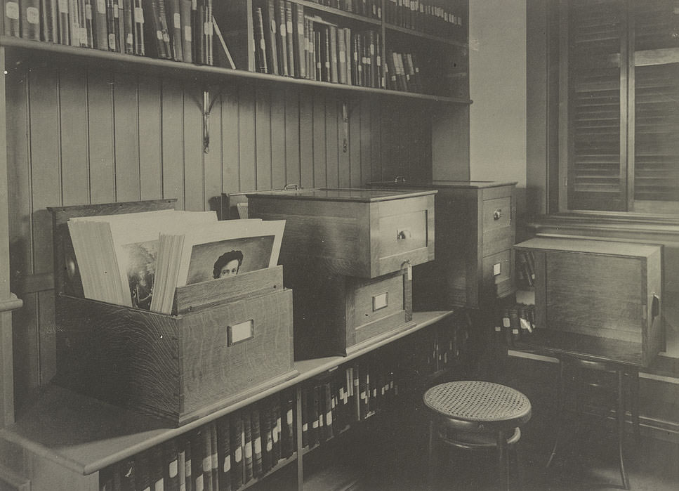 Alcove containing books on art, showing cabinets for storing photographs, 1900