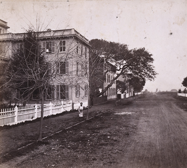 Harrison Street from 12th, looking North, showing University Buildings, Oakland, 1860s