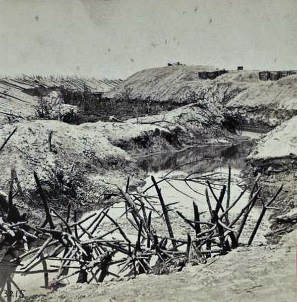 Ditch and "Cheavaux de Frise" in front of the Union Fort Sedgwick, called by the rebel soldiers "Fort Hell", 1865