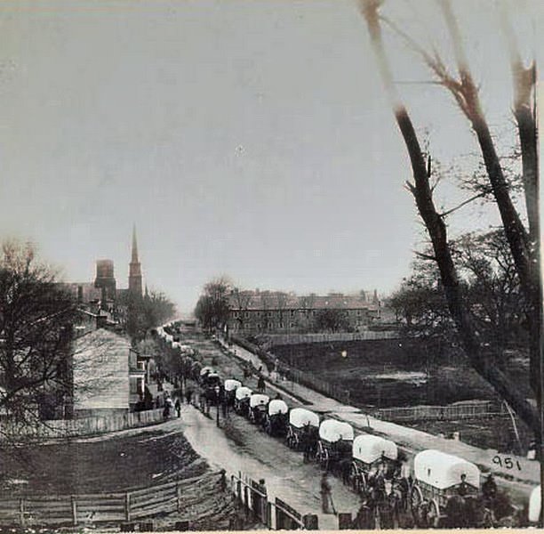 First wagon train entering Petersburg, 1865