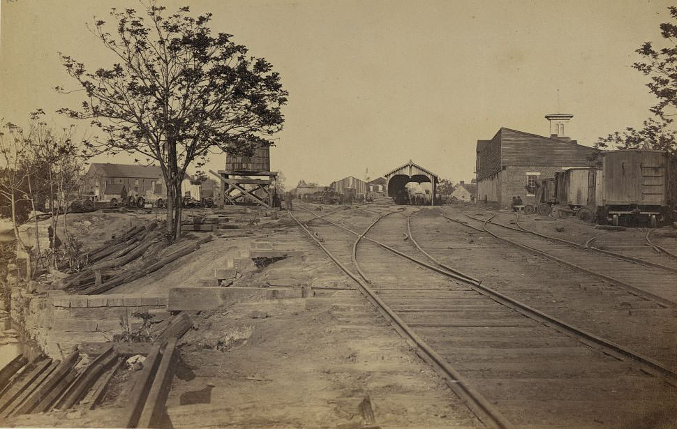 Railroad tracks leading in to a United States Military Railroad station, 1865