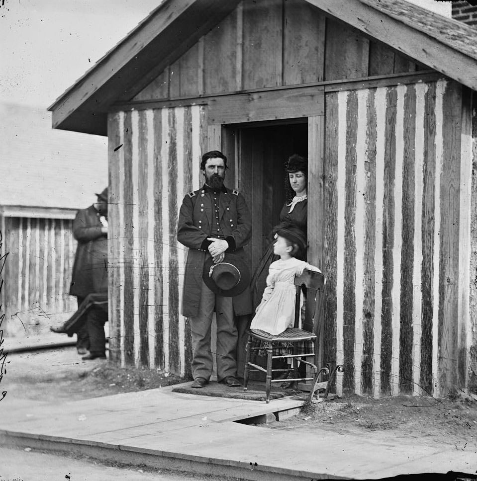 Brig. Gen. John A. Rawlins, Chief of Staff, with wife and child at door of their quarters, Petersburg, 1860