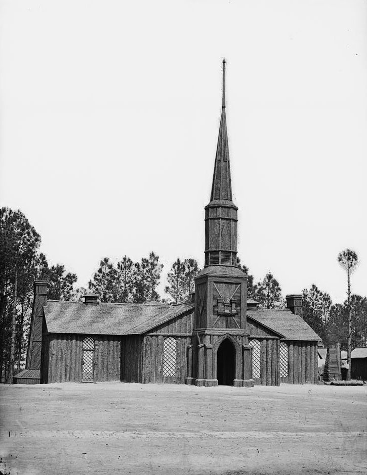 Log church built by the 50th New York Engineers, with the engineer insignia above the door, 1865