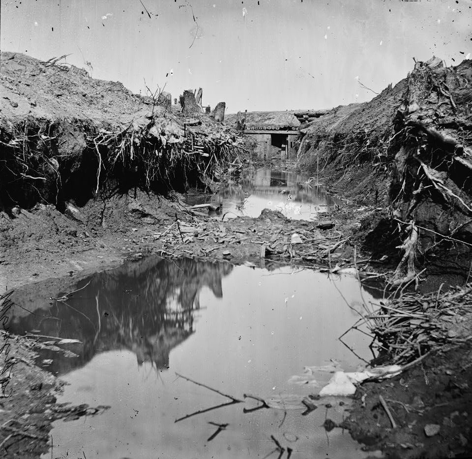 Water-filled ditch on west side of Fort Sedgwick, Petersburg, 1865