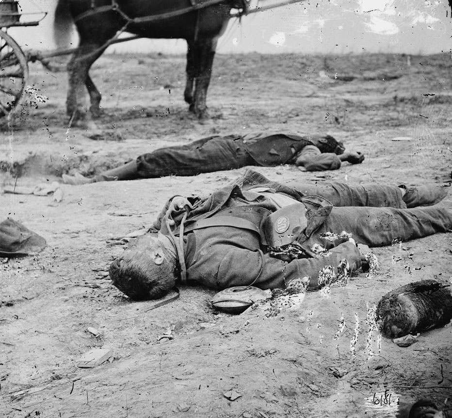 Confederate and Union dead side by side in the trenches at Fort Mahone, 1865