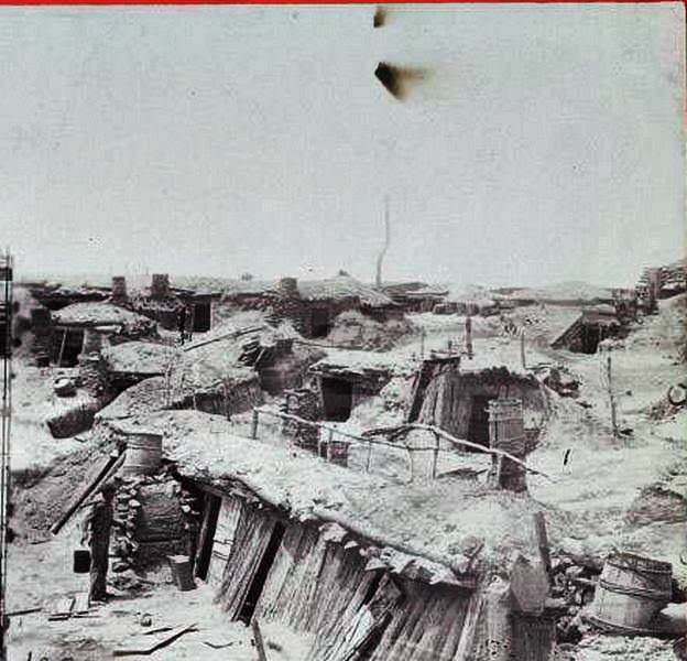 A view of the above ground portion of bomb-proof living quarters in Fort Sedgwick, outside Petersburg, 1865