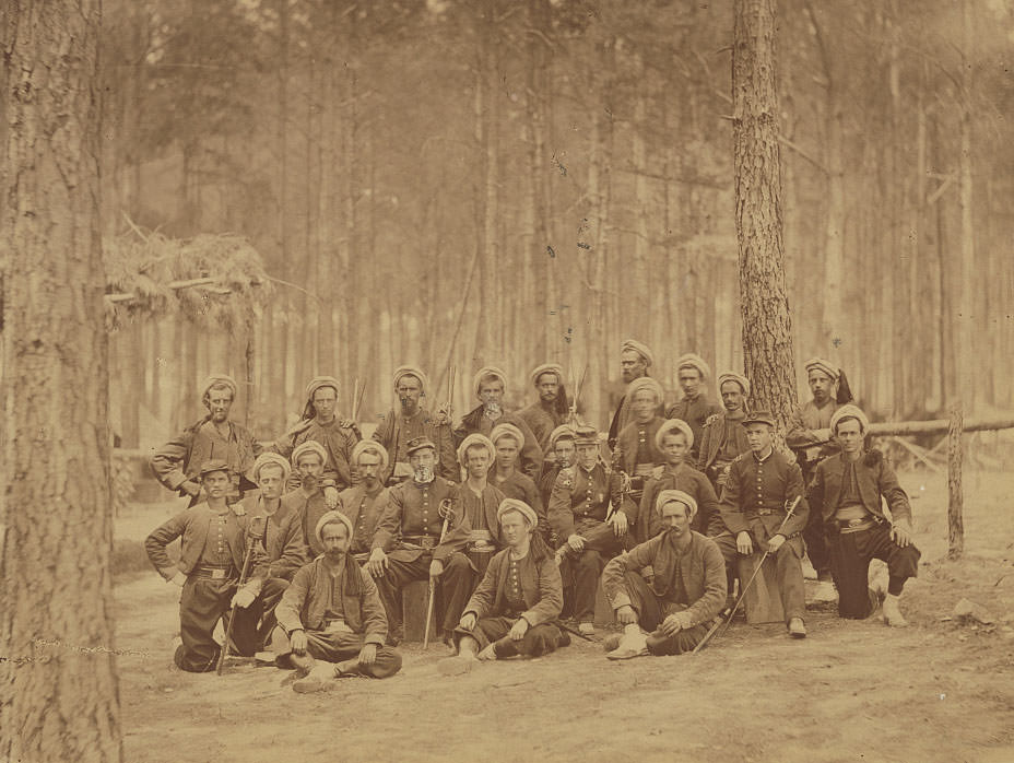 Soldiers in Union uniforms with swords and others in zouave uniforms of 114th Pennsylvania Infantry Regiment, Co. G, Petersburg, 1864