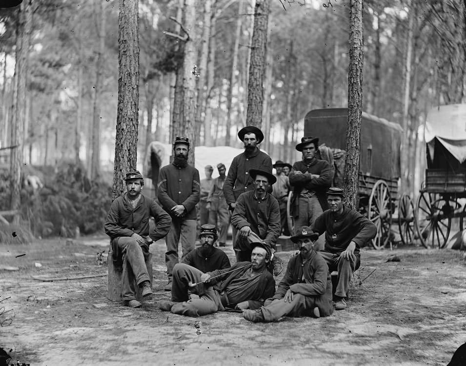 Petersburg, Va. Group of Company B, U.S. Engineer Battalion; wagons in background,1864