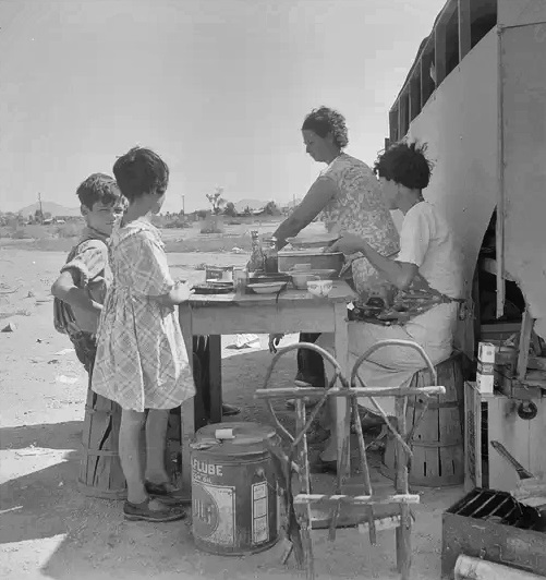 Drought refugees in Phoenix drifting around and looking for work in cotton in August 1936.