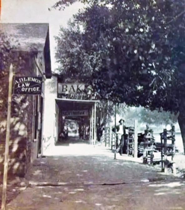 A.D. Lemon's law office, and in the background a restaurant and bakery, with shade-providing awning.