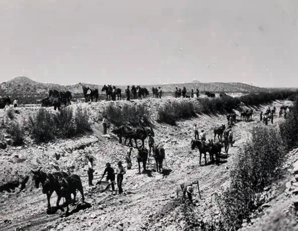 The building of the Arizona Canal, the northernmost of the Valley's major canals, began in 1895. Here it shown is being scraped and maintained in 1905.