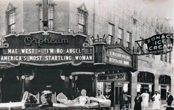 That "startling woman" Mae West appears in front of the Orpheum Theatre in downtown Phoenix to promote her new movie in 1933.