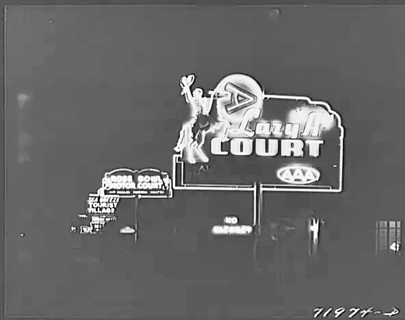 Neon signs light up the night at a Phoenix tourist court in February 1942.