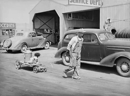 A man hauls water to his home in Phoenix in May 1940.