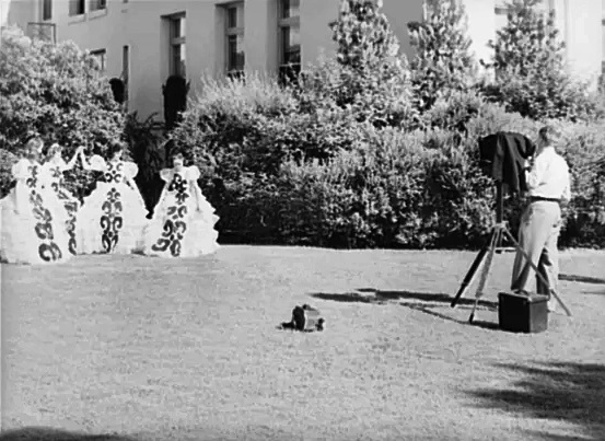 High school girls in Phoenix get photographed in their senior graduation play costumes in May 1940.