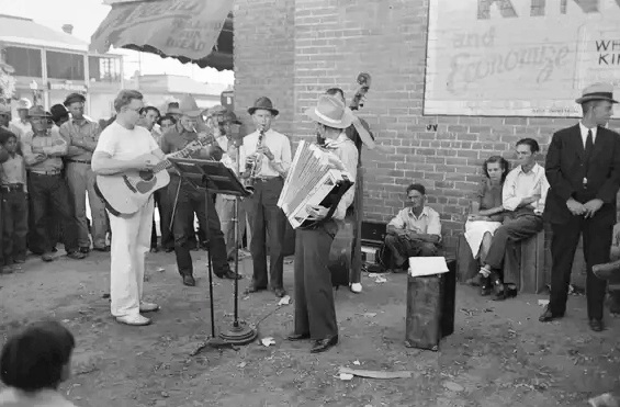 An orchestra plays outside a Phoenix grocery store on Saturday afternoon in May 1940.