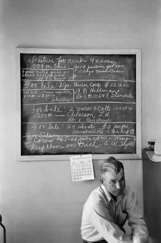 A sign hangs in the Rural Rehabilitation Office of the Farm Security Administration in Phoenix in April 1940.