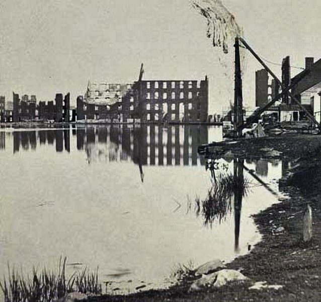 Ruins of the burnt district, from the canal basin, Richmond, 1865