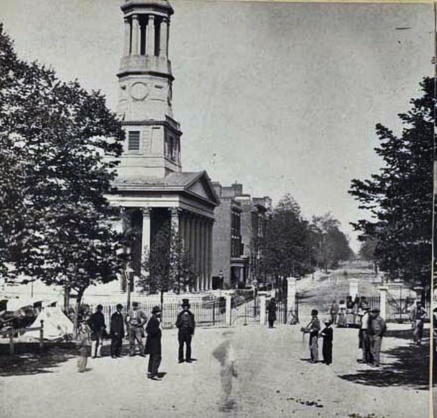 People mingling on the street outside of St. Paul's Episcopal Church on Grace Street in Richmond, Virginia, 1865