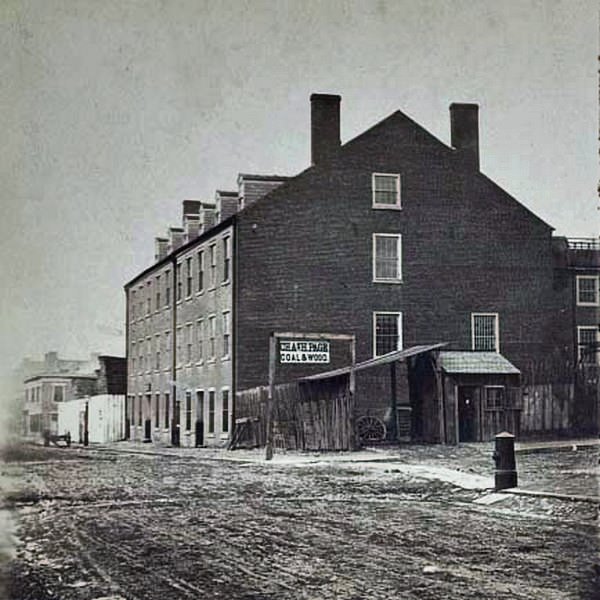 Charles H. Page's Coal and Wood business operating near the brick warehouse that was formerly Castle Thunder, a Civil War prison in Richmond, 1864